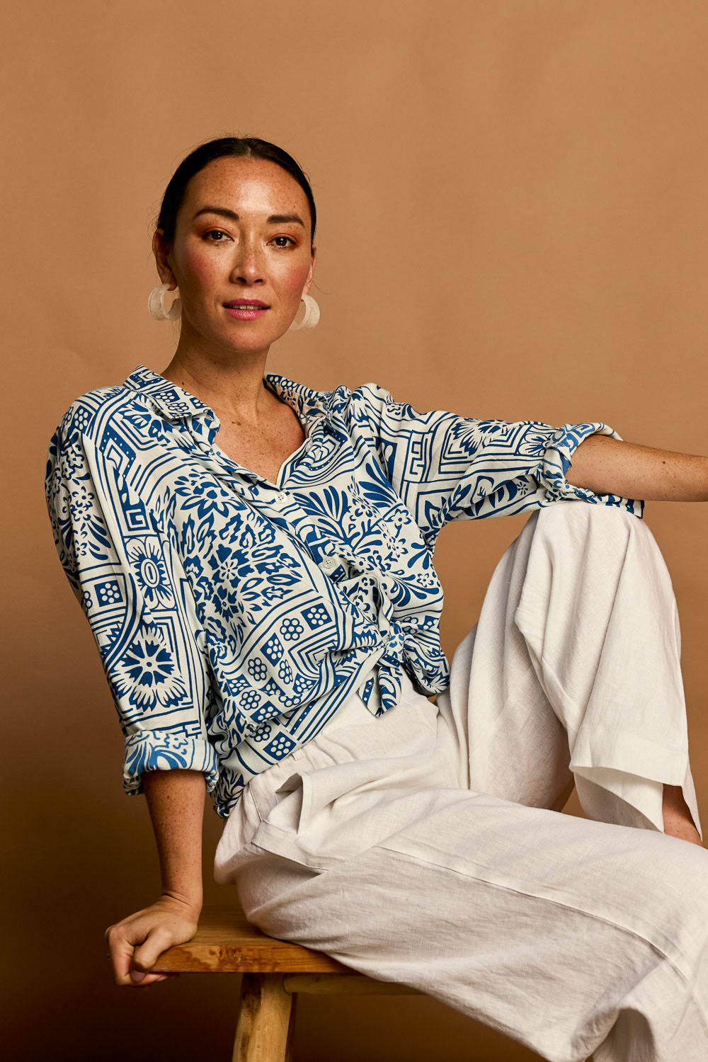 Model Katie wearing size 10 of the Kelly Relaxed Shirt in colour Labyrinth (Blue), from the front, showing the whole outfit