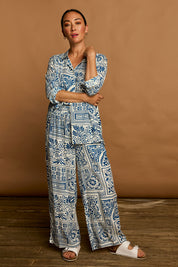 Model Katie wearing size 10 of the Kelly Relaxed Shirt in colour Labyrinth (Blue), from the front, showing the whole outfit
