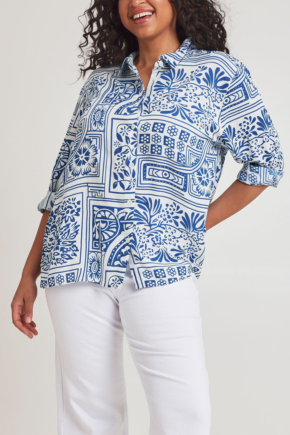 Model Terri-Leigh wearing size 14 of the Kelly Relaxed Shirt in colour Labyrinth (Blue), from the front, cropped image