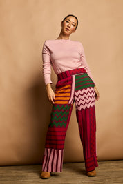 Model Katie wearing size 10 of the Andie Pant in colour Lines (Pink), from the front, showing the whole outfit