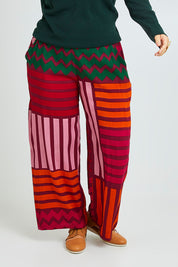 Model Laura wearing size 14 of the Andie Pant in colour Lines (Pink), from the front, cropped image