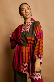 Model Katie wearing size 10 of the Phoebe Relaxed Kimono in colour Lines (Pink), from the front, showing the whole outfit