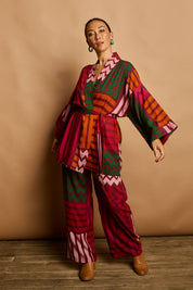 Model Katie wearing size 10 of the Phoebe Relaxed Kimono in colour Lines (Pink), from the front, showing the whole outfit