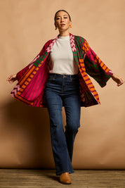 Model Katie wearing size 10 of the Phoebe Relaxed Kimono in colour Lines (Pink), from the front, showing the whole outfit