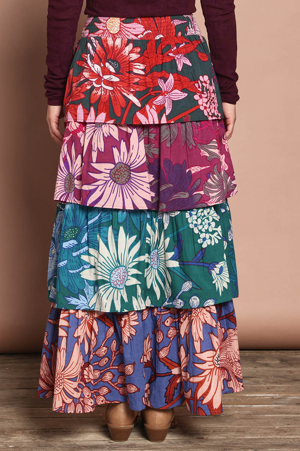 Model Katie wearing size 10 of the Juliet Cotton Tiered Skirt in colour Garden, from the back