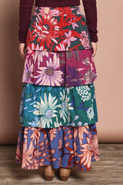 Model Katie wearing size 10 of the Juliet Cotton Tiered Skirt in colour Garden, from the back