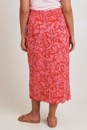 Model Terri-Leigh wearing size 14 of the Camilla Cotton Scalloped Hem Skirt in colour Flowerpop (Red), from the back