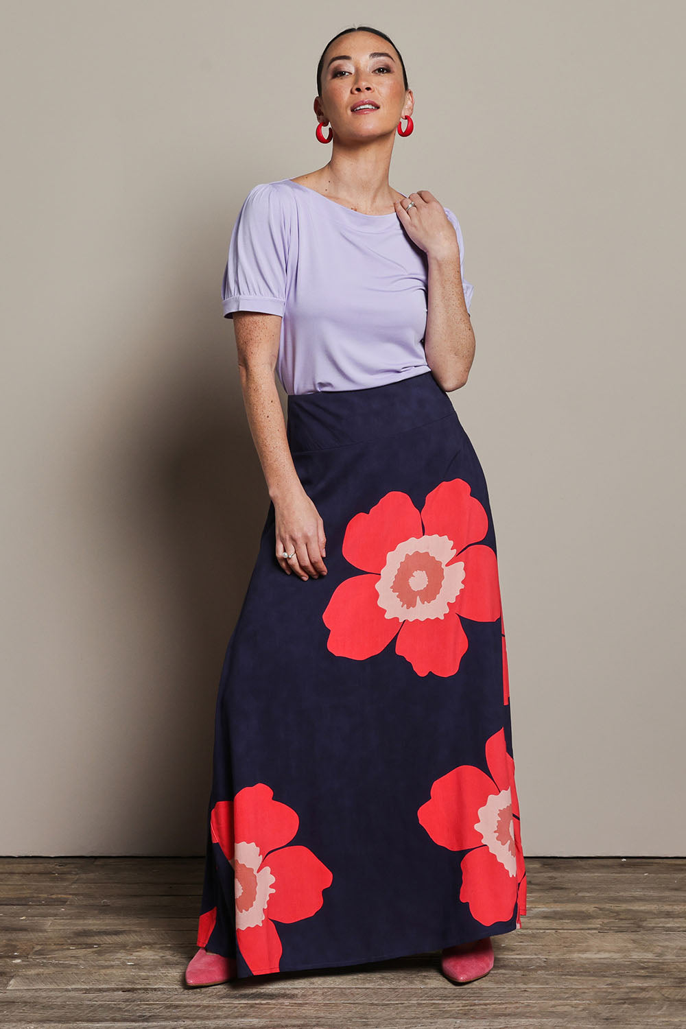 Model Katie wearing size 10 of the Rosie Maxi Skirt in colour Boldflower (Blue), from the front, showing the whole outfit
