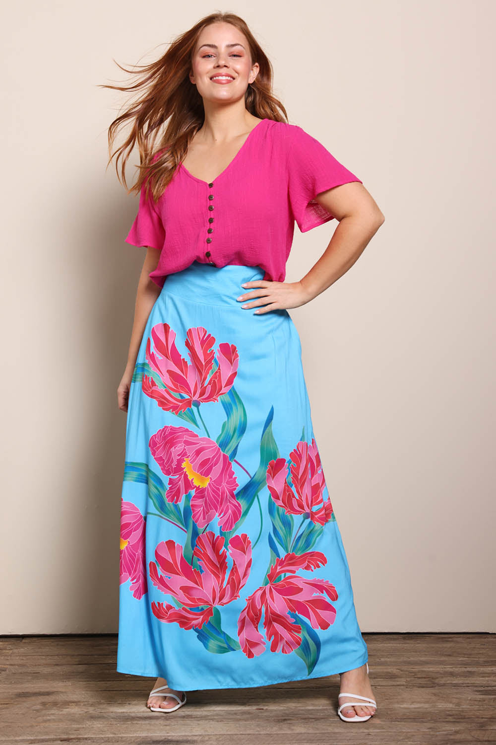 Model Georgiel wearing size 10 of the Rosie Maxi Skirt – Meadow in colour Meadow, from the front