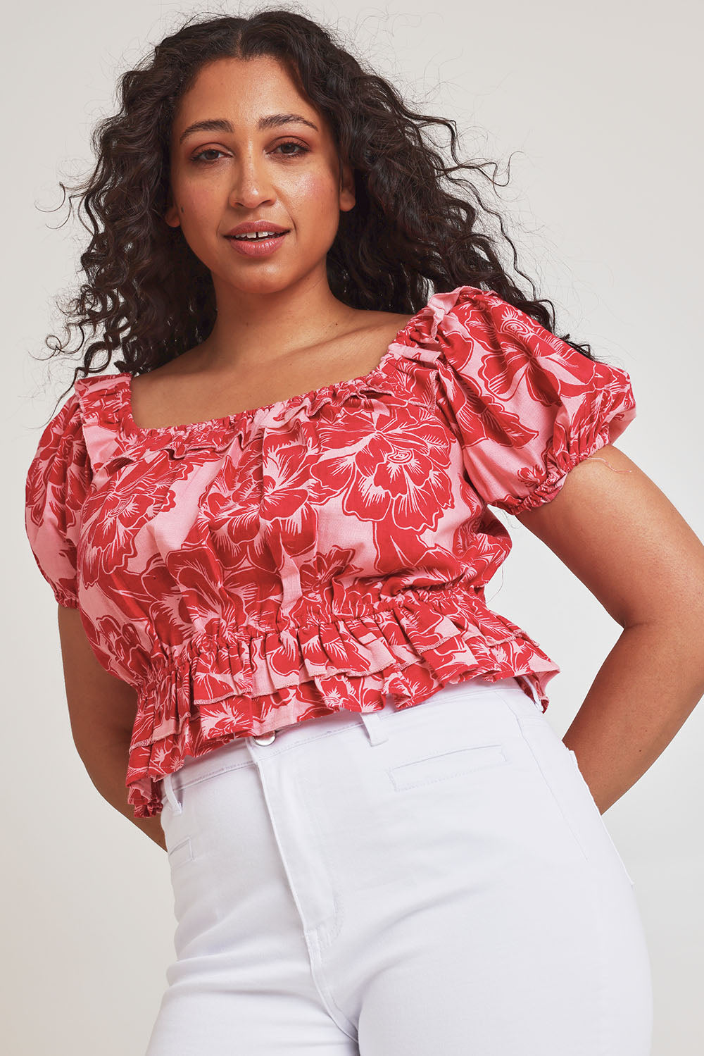 Model Terri-Leigh wearing size 14 of the Annie Cotton Frill Blouse in colour Blooming (Pink), from the front, cropped image