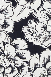 Product shot of the Anastasia Cotton Wrap Dress in colour Blooming (Black), detail
