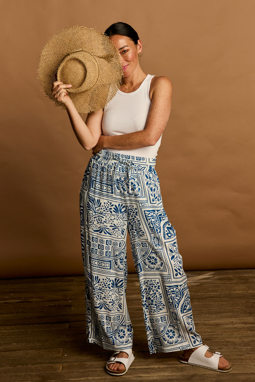 Model Katie wearing size 10 of the Katherine Pant in colour Labyrinth (Blue), from the front, showing the whole outfit