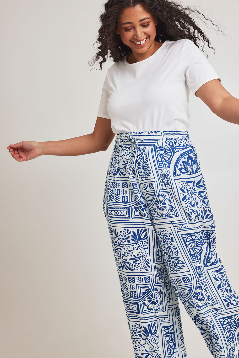 Model Terri-Leigh wearing size 14 of the Katherine Pant in colour Labyrinth (Blue), from the front, cropped image