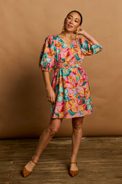 Model Katie wearing size 10 of the Vera Cotton Dress in colour Botanical, from the front, showing the whole outfit