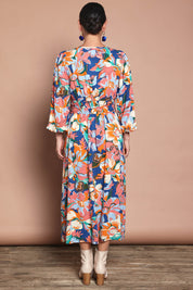 Model Katie wearing size 10 of the Gwyn Midi Dress in colour Botanical, from the back