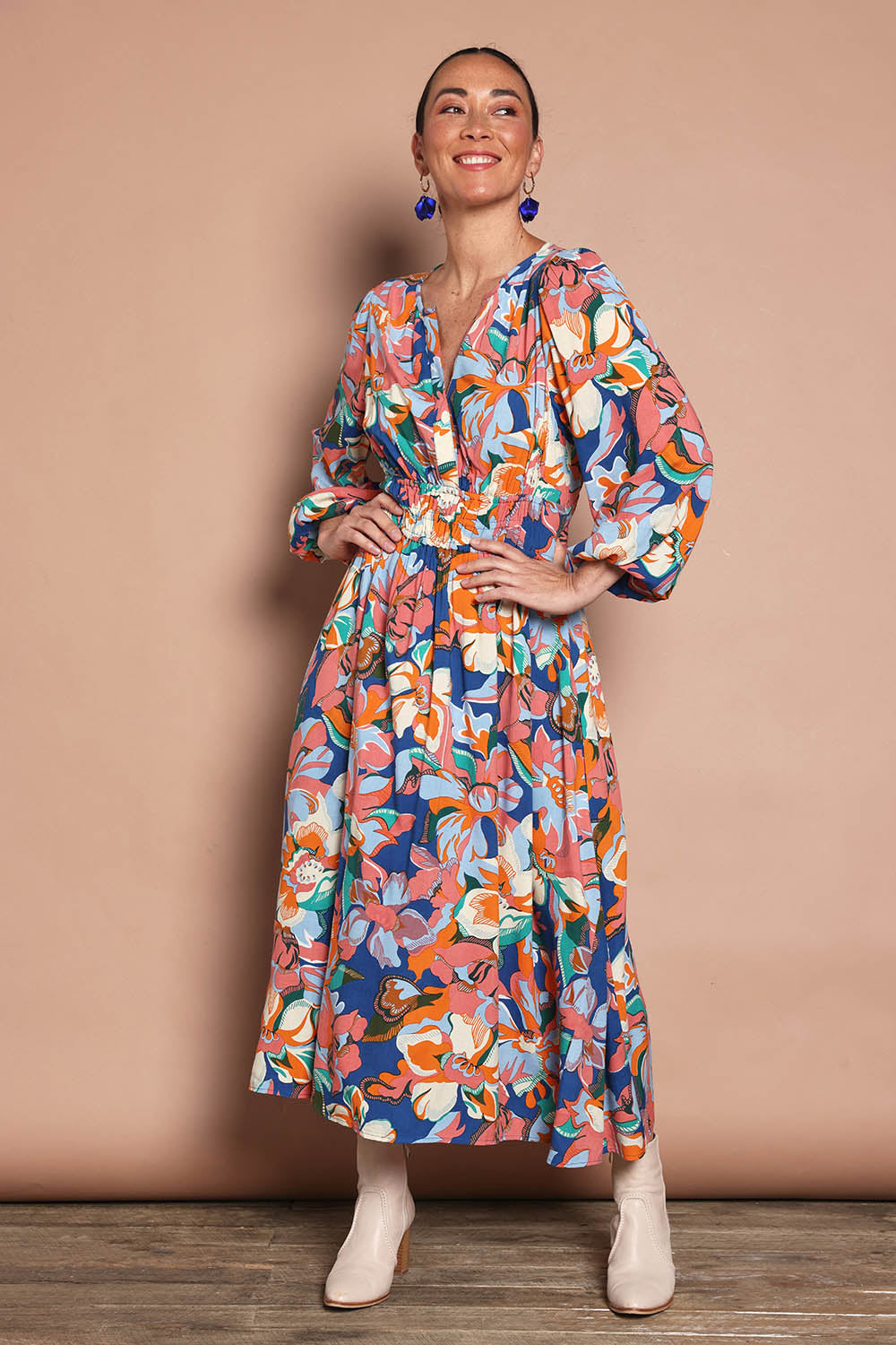 Model Katie wearing size 10 of the Gwyn Midi Dress in colour Botanical, from the front, showing the whole outfit