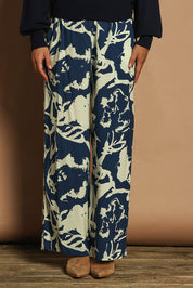 Model Katie wearing size 10 of the Kayla Pant in colour Inkblot (Blue), from the front, cropped image