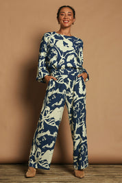 Model Katie wearing size 10 of the Kayla Pant in colour Inkblot (Blue), from the front, showing the whole outfit
