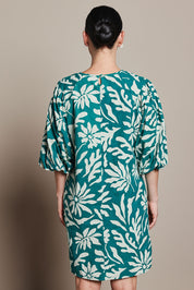 Model Katie wearing size 10 of the Josephine Cotton Dress in colour Gerbera (Green), from the back