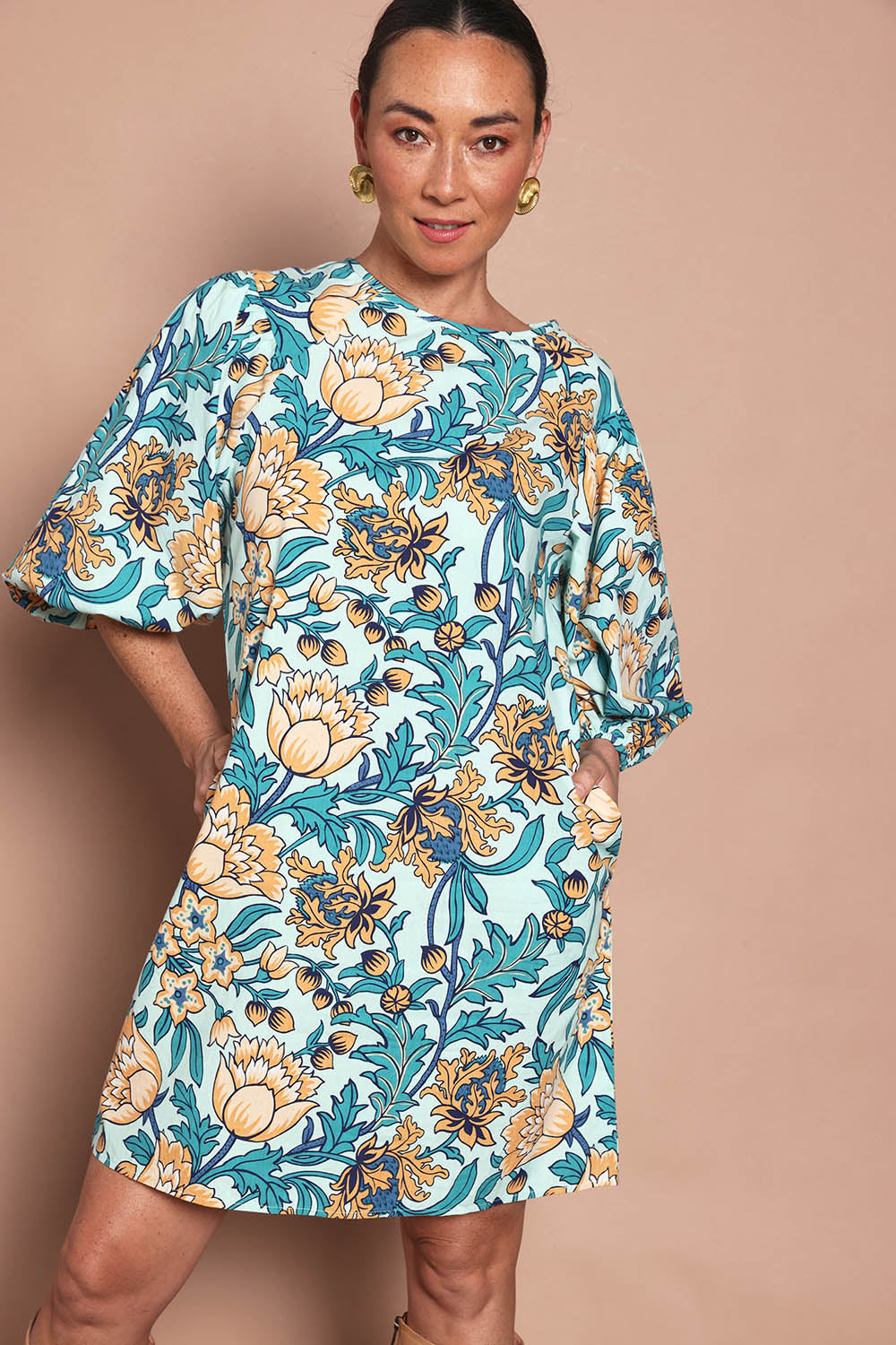 Model Katie wearing size 10 of the Josephine Cotton Dress in colour Thistle, from the front, cropped image