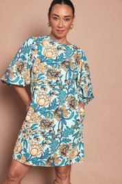 Model Katie wearing size 10 of the Josephine Cotton Dress in colour Thistle, from the front, cropped image
