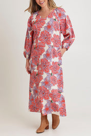 Model Chanel wearing size 16 of the Aimee Aline Cotton Dress in colour Rosettes, from the front, cropped image