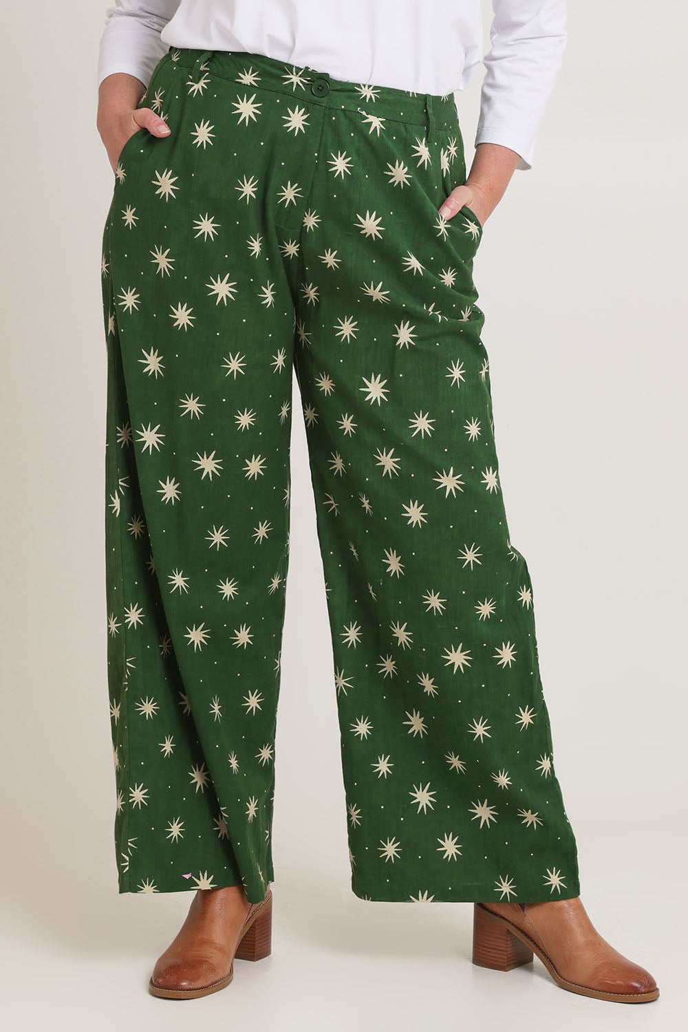 Model Chanel wearing size 16 of the Patricia Cotton Pant in colour Nightsky (Green), from the front, cropped image