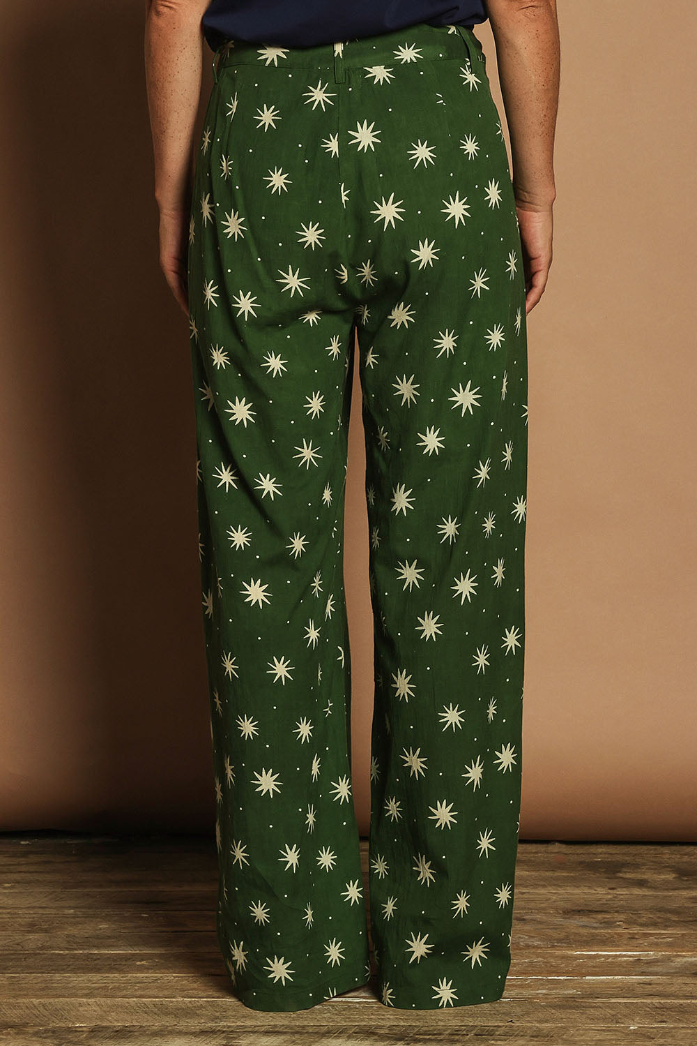 Model Katie wearing size 10 of the Patricia Cotton Pant in colour Nightsky (Green), from the back