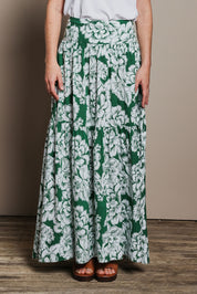 Model Katie wearing size 10 of the Ella Tiered Skirt in colour Blooming (Green), from the front, cropped image