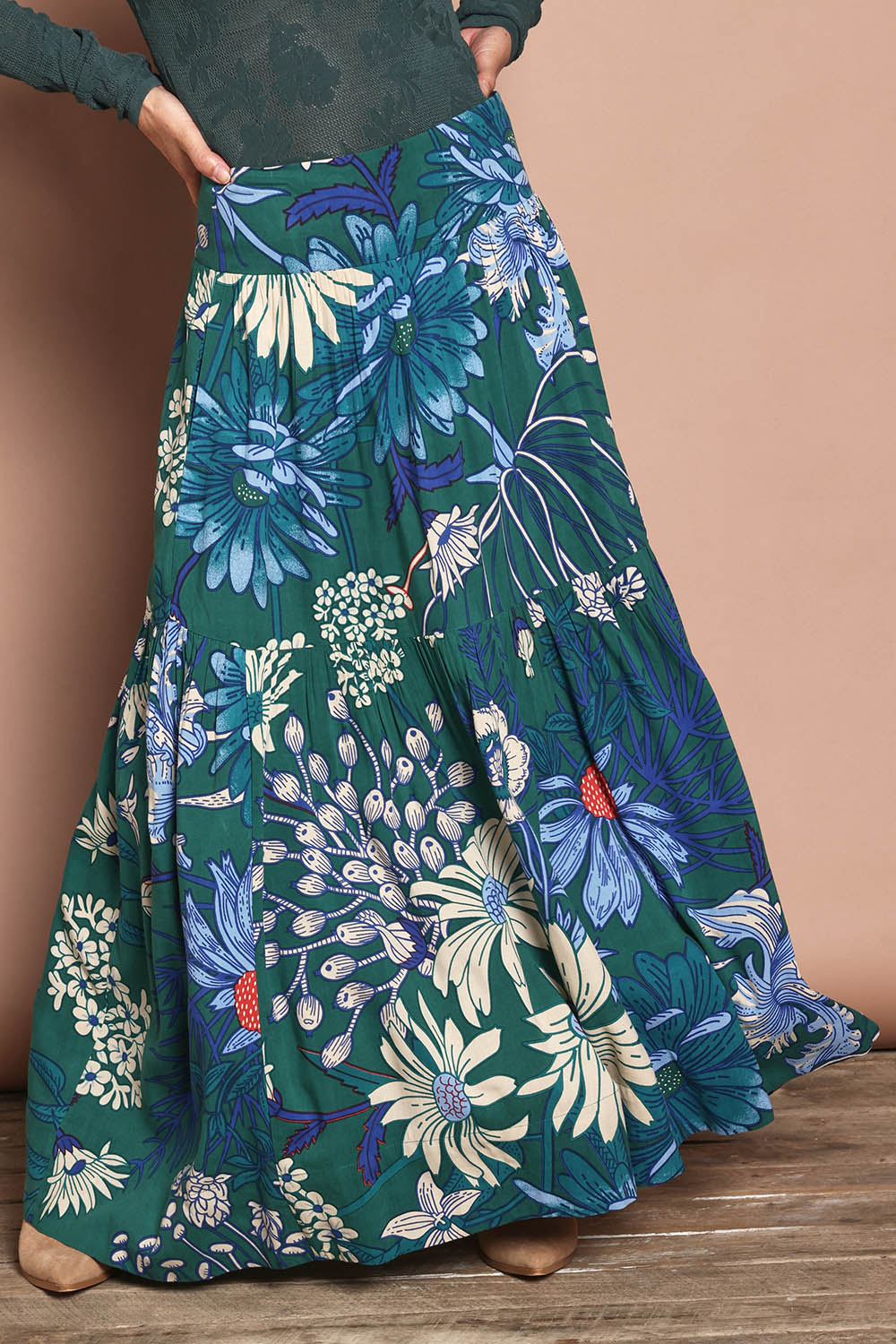 Model Katie wearing size 10 of the Ella Tiered Skirt in colour Deepgreen (Green), from the front, cropped image
