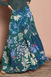 Model Katie wearing size 10 of the Ella Tiered Skirt in colour Deepgreen (Green), from the front, cropped image