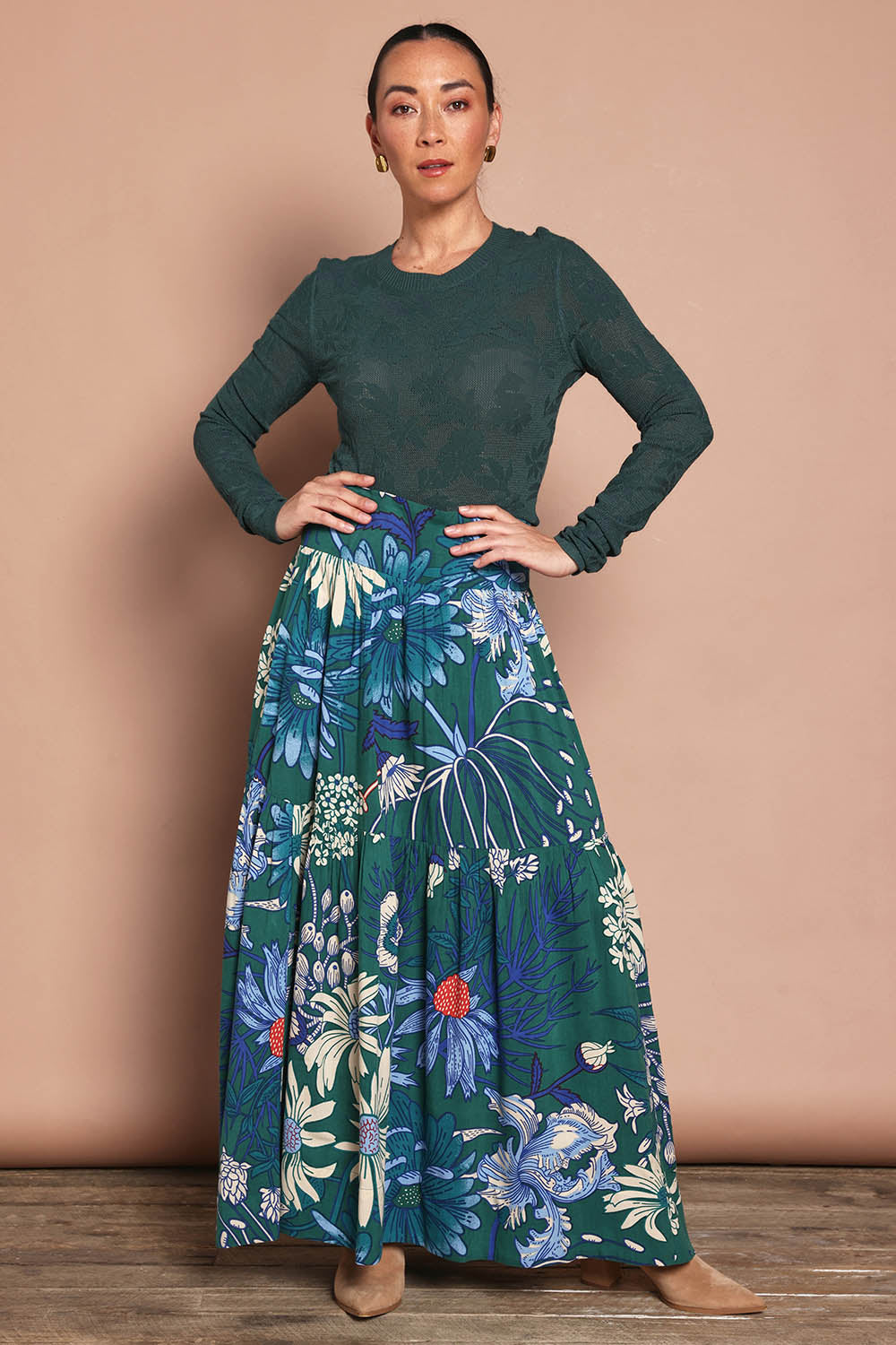 Model Katie wearing size 10 of the Ella Tiered Skirt in colour Deepgreen (Green), from the front, showing the whole outfit