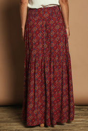 Model Katie wearing size 10 of the Ella Tiered Skirt in colour Geometric, from the back