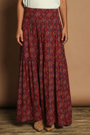 Model Katie wearing size 10 of the Ella Tiered Skirt in colour Geometric, from the front, cropped image