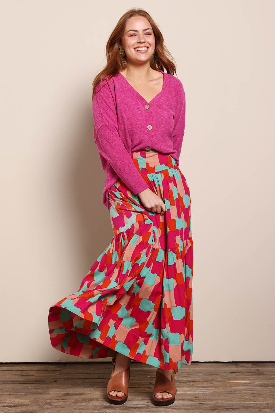 Model Georgiel wearing size 10 of the Ella Tiered Skirt – Paintbrush in colour Paintbrush, from the front