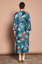 Model Katie wearing size 10 of the Derek Wrap Midi Dress in colour Petalrush, from the back