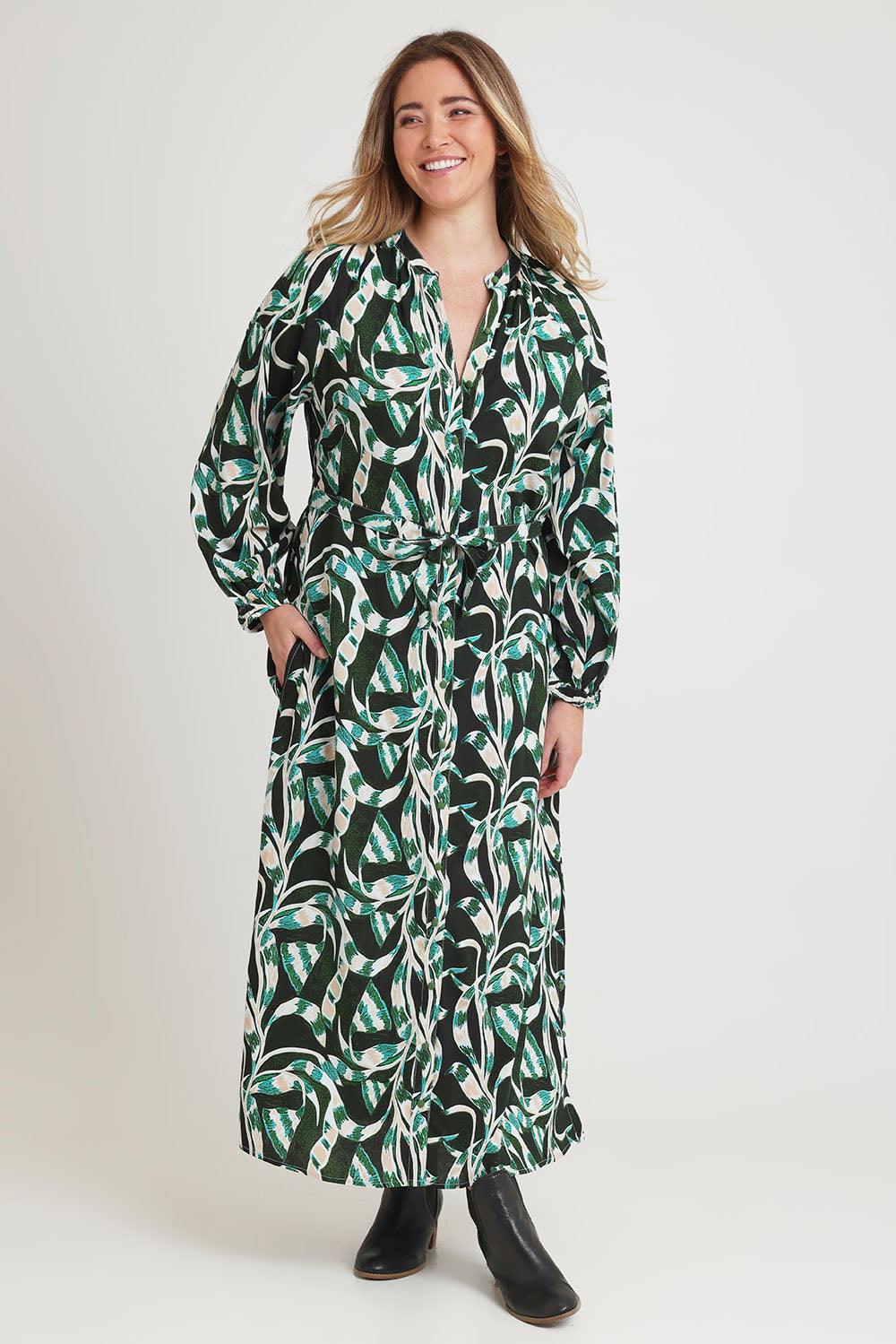 Model Chanel wearing size 16 of the Taylor Button Up Dress in colour Twistvine (Green), from the front, showing the whole outfit