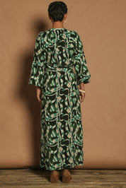 Model Katie wearing size 10 of the Taylor Button Up Dress in colour Twistvine (Green), from the back