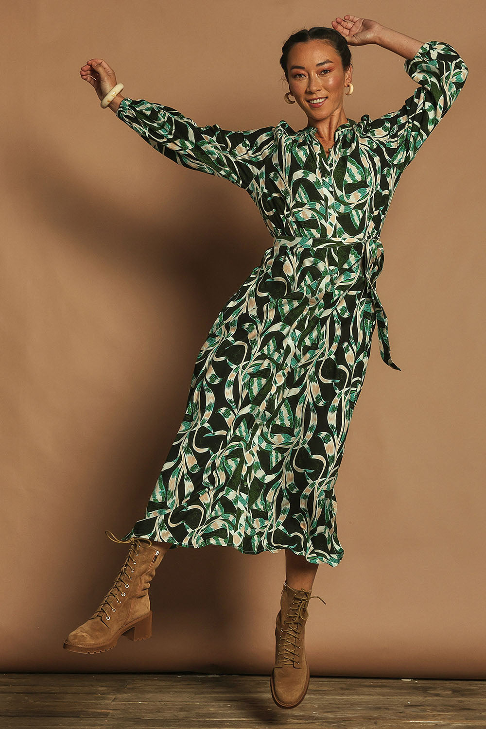 Model Katie wearing size 10 of the Taylor Button Up Dress in colour Twistvine (Green), from the front, showing the whole outfit