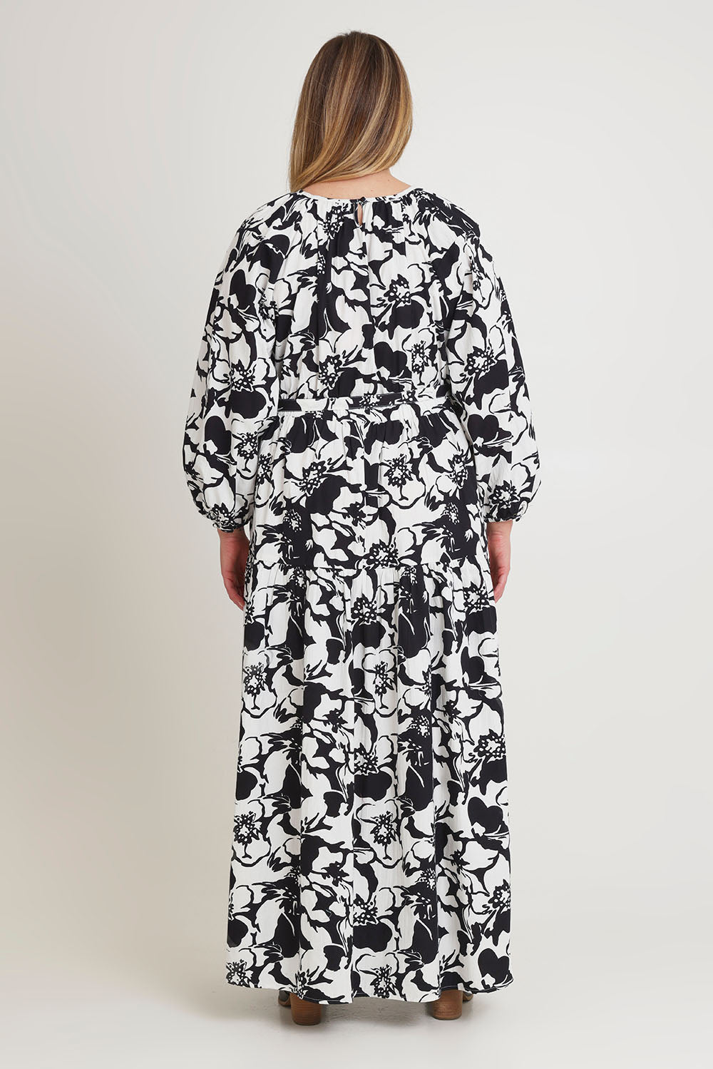 Model Chanel wearing size 16 of the Ruth Cotton Maxi Dress in colour Windfleur (Black), from the back