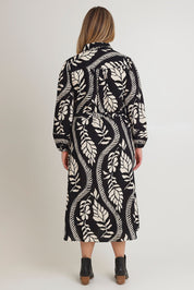 Model Chanel wearing size 16 of the Leah Midi Shirt Dress in colour Blkvine (Black), from the back