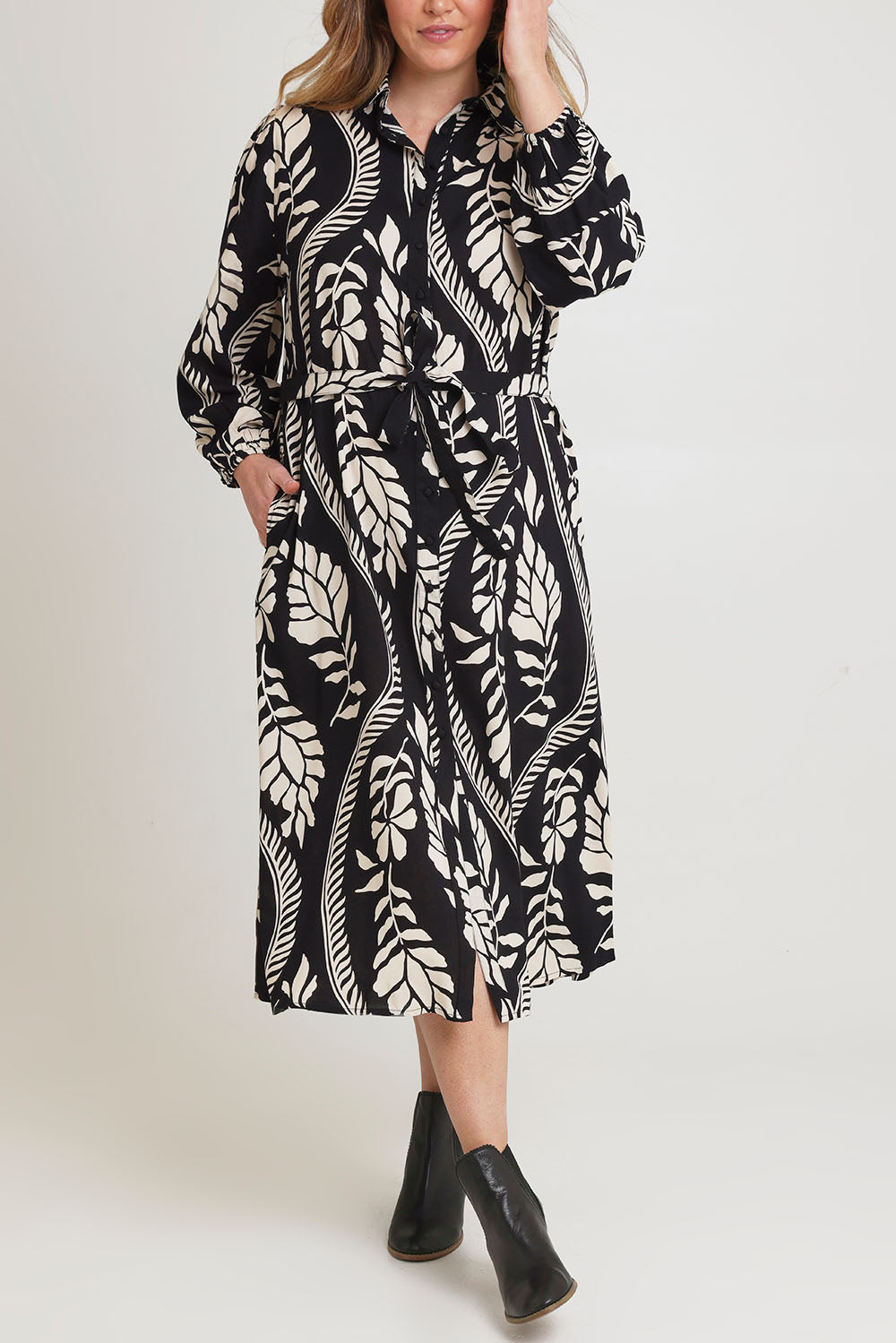 Model Chanel wearing size 16 of the Leah Midi Shirt Dress in colour Blkvine (Black), from the front, cropped image