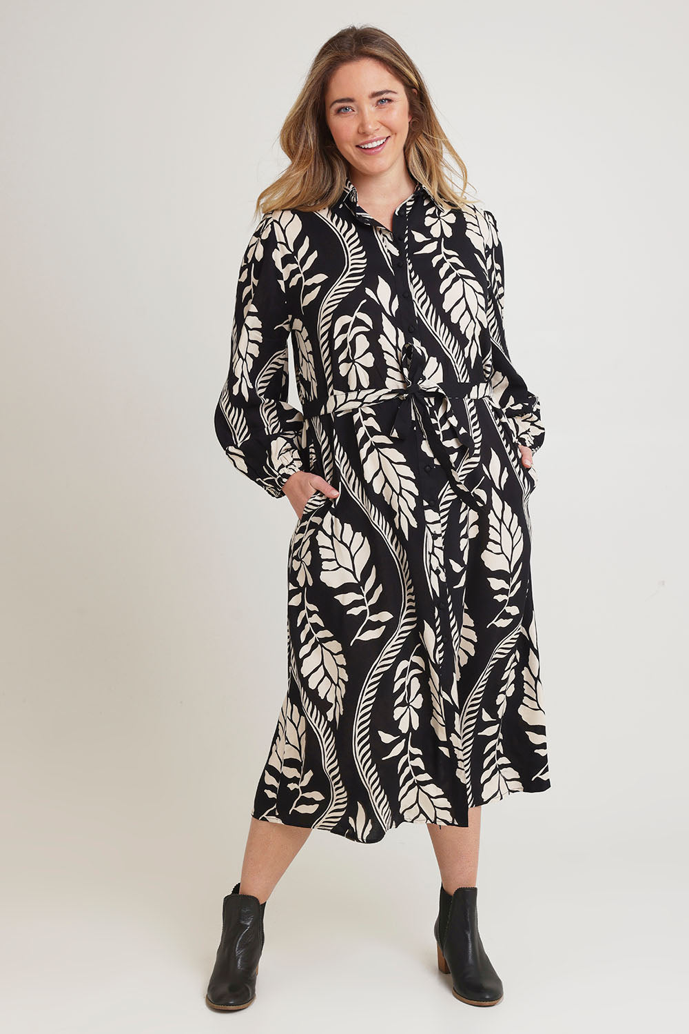 Model Chanel wearing size 16 of the Leah Midi Shirt Dress in colour Blkvine (Black), from the front, showing the whole outfit
