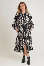 Model Chanel wearing size 16 of the Leah Midi Shirt Dress in colour Blkvine (Black), from the front, showing the whole outfit