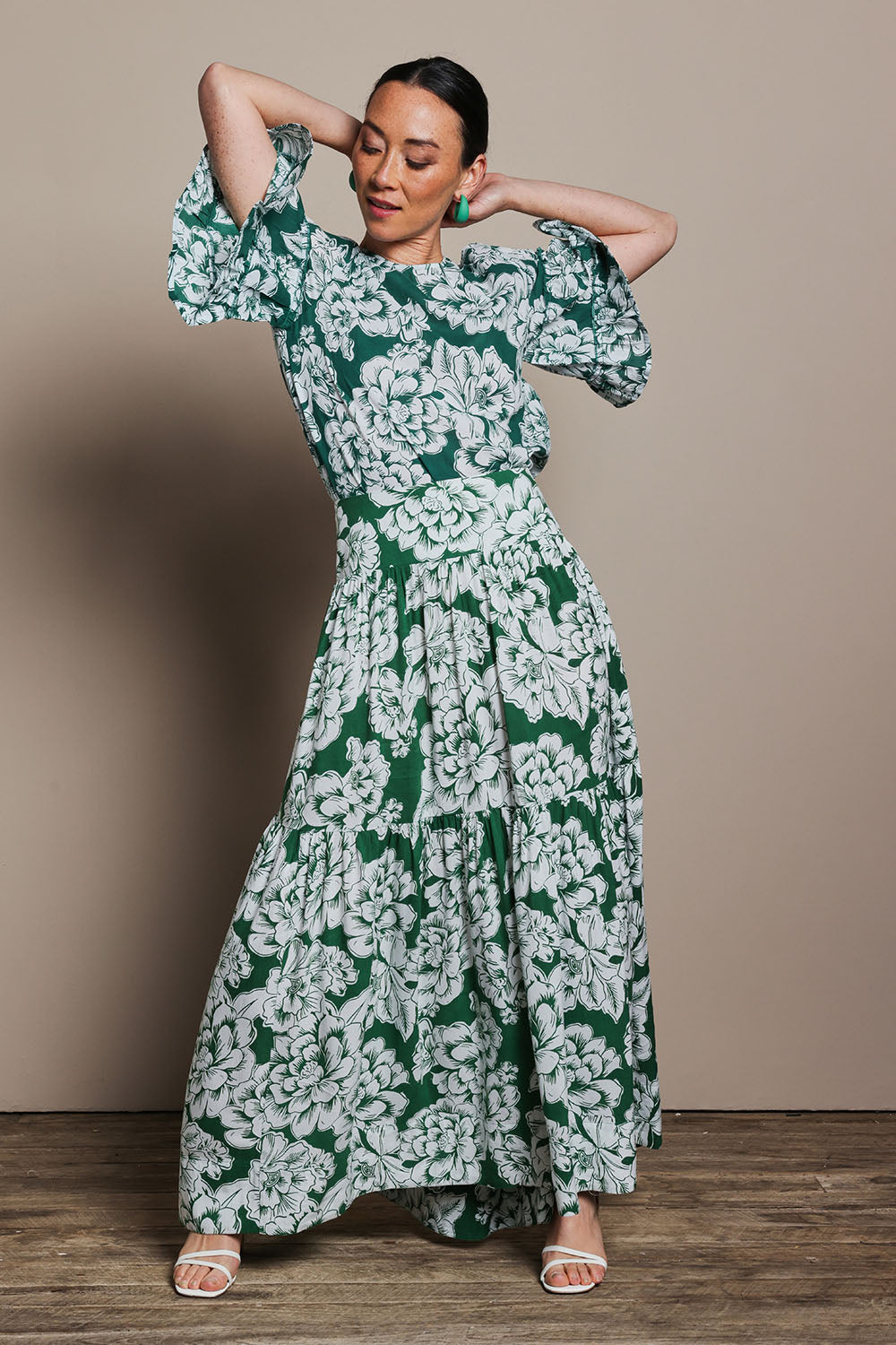 Model Tahnee wearing size 10 of the Kylie Frill Sleeve Cotton Top in colour Blooming (Green), from the front, showing the whole outfit