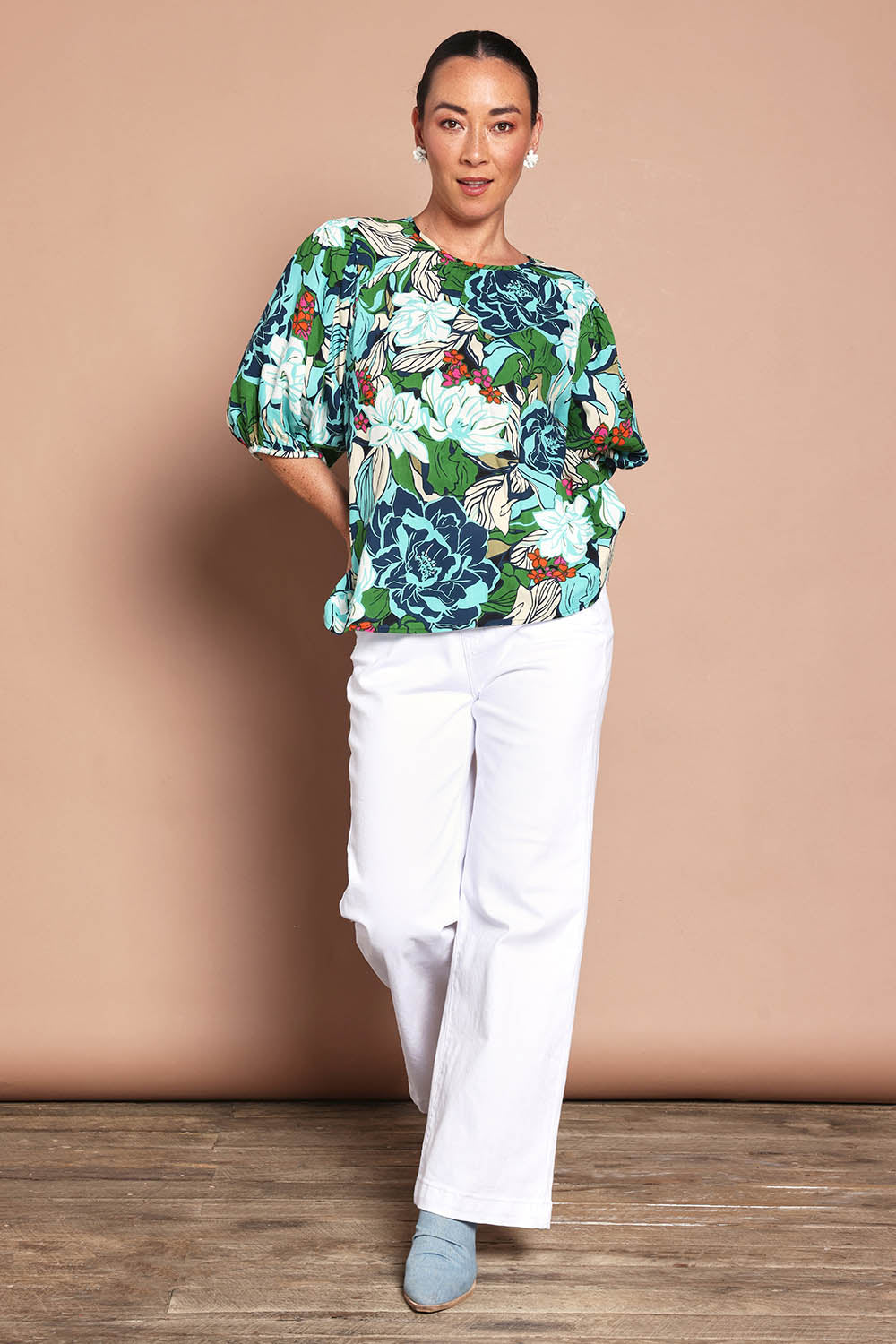 Model Katie wearing size 10 of the Ria Puff Sleeve Top in colour Bouquet, from the front, showing the whole outfit