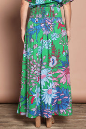 Model Katie wearing size 10 of the Rosemary Cotton Maxi Skirt in colour Greengard (Green), from the back