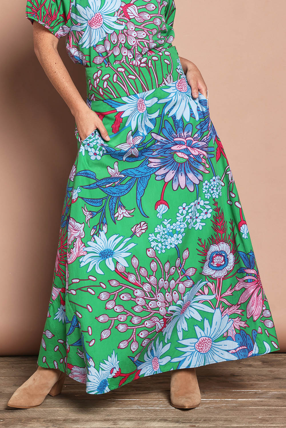 Model Katie wearing size 10 of the Rosemary Cotton Maxi Skirt in colour Greengard (Green), from the front, cropped image