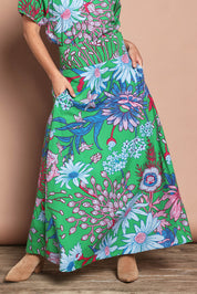 Model Katie wearing size 10 of the Rosemary Cotton Maxi Skirt in colour Greengard (Green), from the front, cropped image