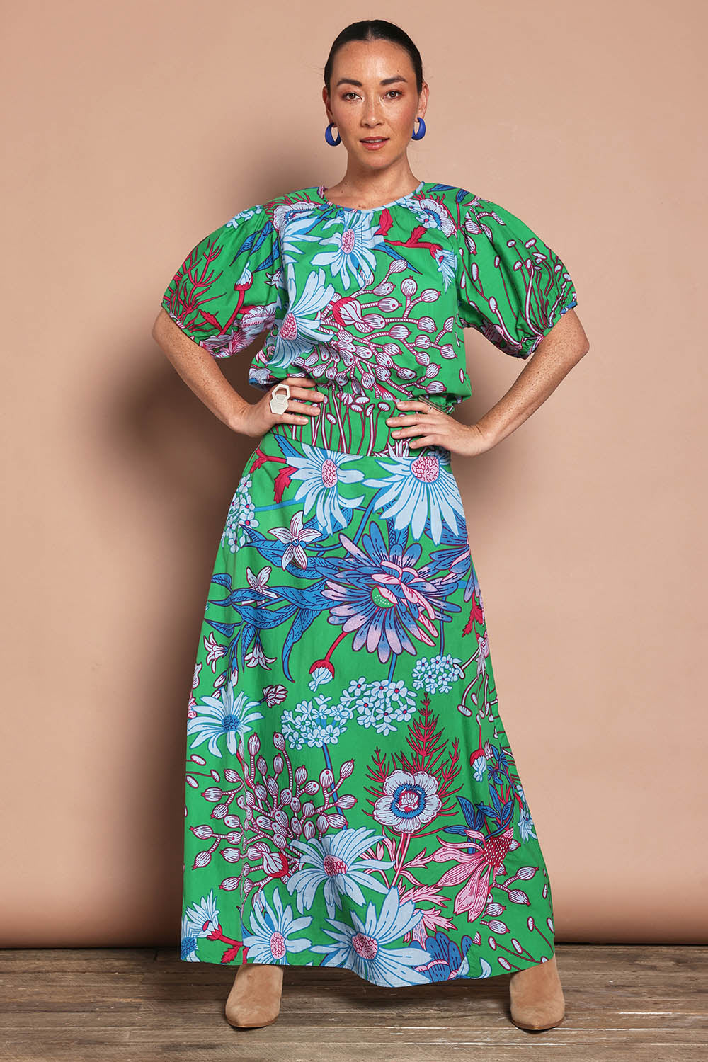 Model Katie wearing size 10 of the Rosemary Cotton Maxi Skirt in colour Greengard (Green), from the front, showing the whole outfit